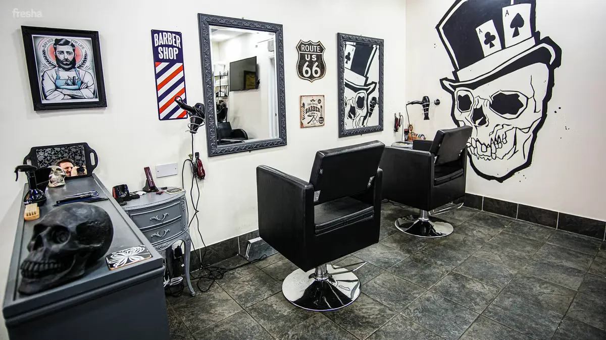 Jurassic Cut interior with skull wall art and barber chairs